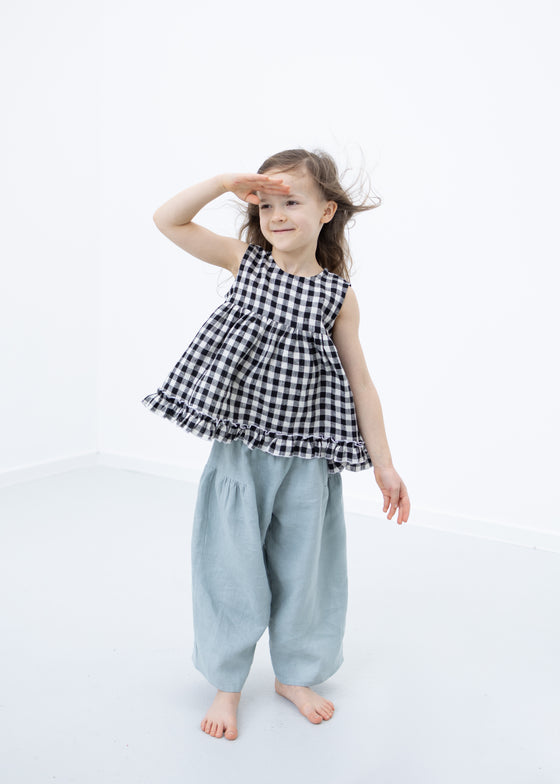 Linen blouse with ruffle hem