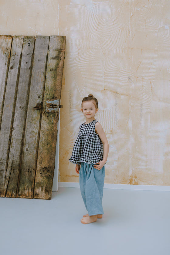 Linen blouse with ruffle hem